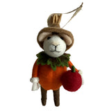 Felted animal toy mouse in an orange pumpkin with a red apple ready for Halloween 