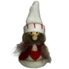 Small gnome figurine with a white hat and red accents on a plain background