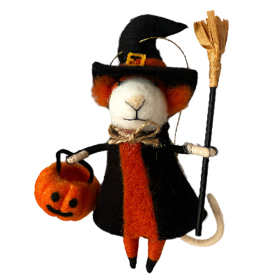 Halloween-themed toy cat in a witch costume with a broom and pumpkin.