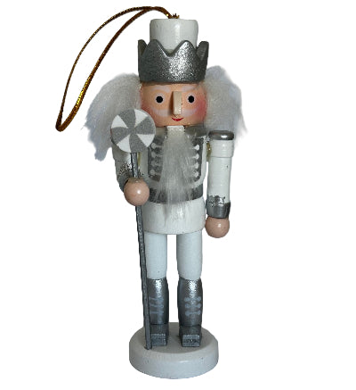 Wooden nutcracker ornament on a white background
