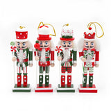 Set of four Christmas nutcracker ornaments on a white background