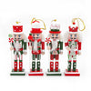 Set of four Christmas nutcracker ornaments on a white background