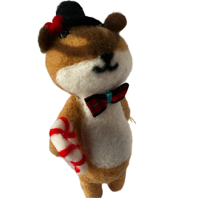 Felted Squirrel Christmas decoration holding a red and white candy cane and wearing a bow tie and top hat.