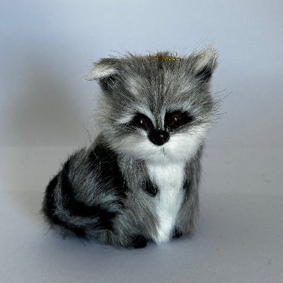 Woodland Raccoon with gray fur pattern on a light gray background
