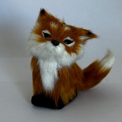 Fur fox head mount on a white background