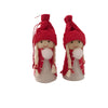 Two Christmas angel figures with red hats and white pom pom details, set against a white background.