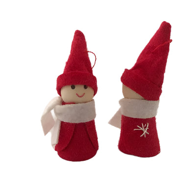 Two Christmas decorations made of wood and felt, one standing upright and the other lying flat, both with white scarves and red hats.